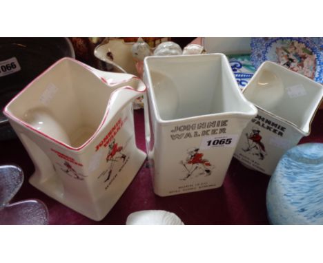 A Wade Regicor pub water jug of tall cube form advertising Johnnie Walker Scotch Whisky - sold with two similar James Green &