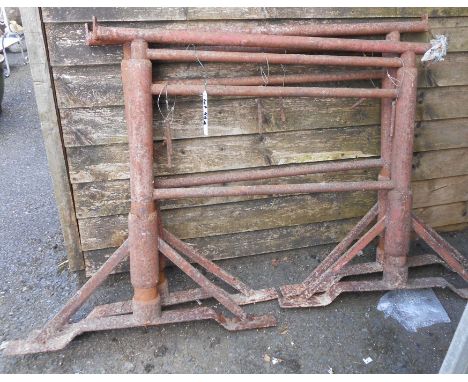 A pair of vintage Acrow style adjustable props