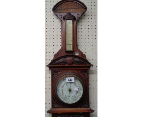 A late Victorian ornate walnut framed wall barometer/thermometer with printed ceramic dial and aneroid works - some moulding 