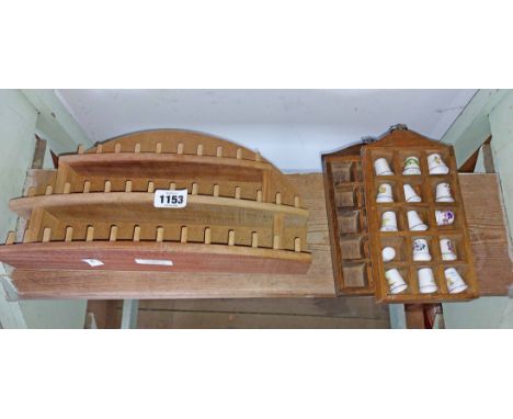 A small display case containing a quantity of collectable ceramic thimbles including Hammersly, Royal Worcester, etc. - sold 