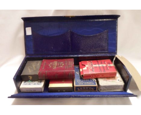 A WWI related leather bridge and draw bridge card box with gilt inscription to lid containing a quantity of playing cards and