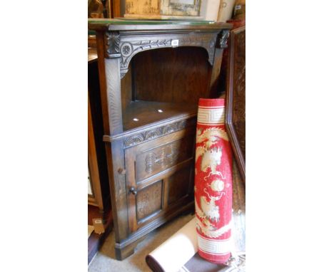 A 74cm vintage Bevan Funnell (Reprodux) oak freestanding corner cabinet with open shelf over further shelves enclosed by a pa