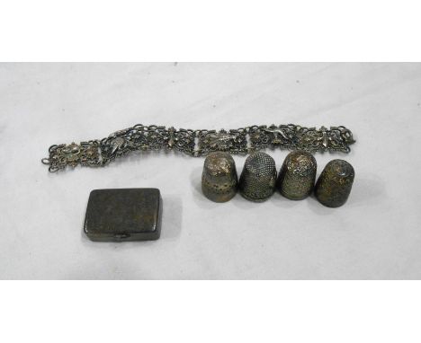 An Oriental marked 88 white metal pill box with gilt interior - sold with a silver thimble, three plated examples and an orna