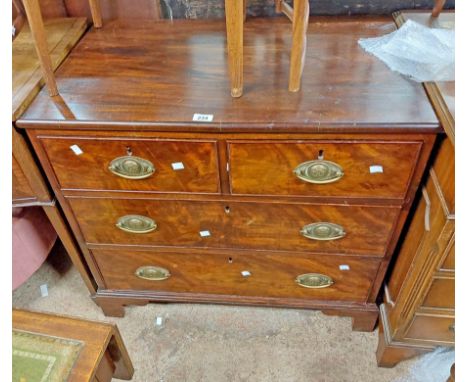 An 83cm Victorian figured mahogany chest of two short and two long graduated drawers, set on bracket feet