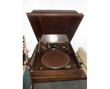 An old wooden cased HMV table gramophone (water damage to one side) - sold with a box containing a quantity of 78rpm records 