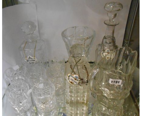 A cut glass spirit decanter of square form with a ceramic brandy label - sold with six tumblers, a similar spirit decanter wi