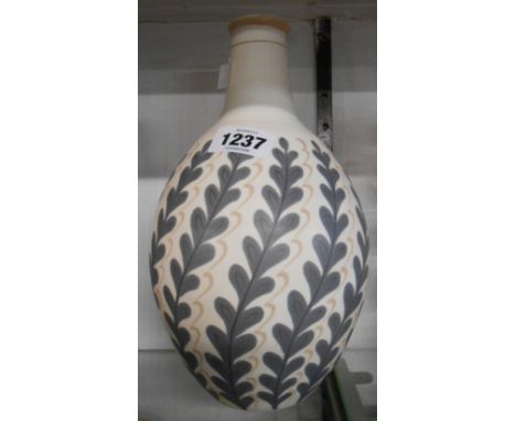 A mid Century Poole Pottery free form vase from a design by Alfred Read of bottle form with hand painted leaf form decoration