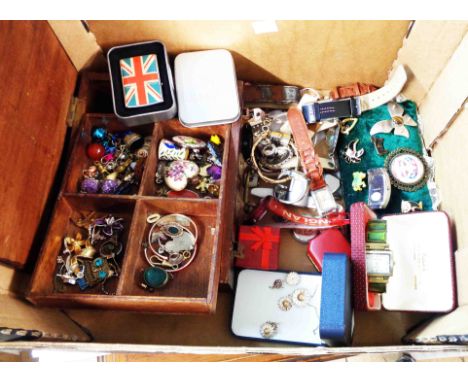 A box containing a quantity of assorted costume jewellery, modern wristwatches, and a boxed Hugo Buscser Zippo style Union Ja