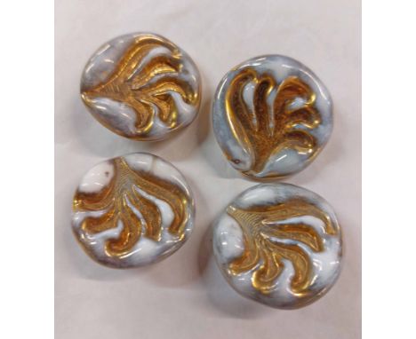 A set of four Orplid Bimani decorative glass buttons (probably designed by Lucie Rie) with impressed decorative frond motif a