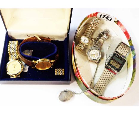 A Tisot watch box containing two Rado quartz wristwatches - sold with another box containing a Casio 'Alarm Chrono' battery l