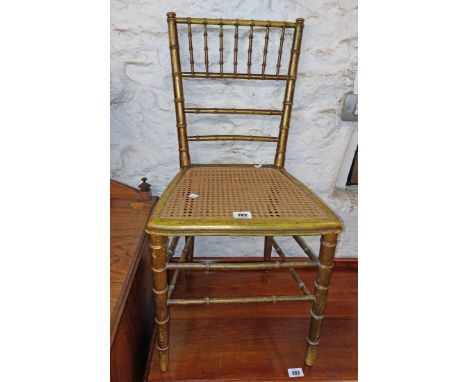 A late 19th Century French faux bamboo giltwood boudoir chair with rattan panel seat and bearing label for Perret et Fils et 