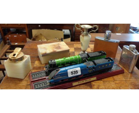 Two modern train models, the Mallard and the Flying Scotsman set on wooden plinths - sold with a small stainless steel spirit