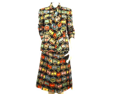 LIBERTY (COJANA) A rare geometric print 1960s wool skirt suit. Fully lined and finished with silver coloured buttons. Fits a 