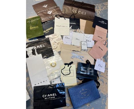 A very large collection of designer boxes, packaging, dust bags and carrier bags suitable for display to include a large CHAN