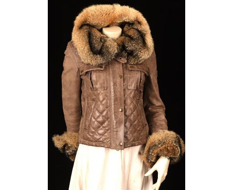 BELSTAFF (CHARITY SALE) A ladies quilted brown leather biker style jacket with real fox/raccoon fur collar and cuffs. Probabl