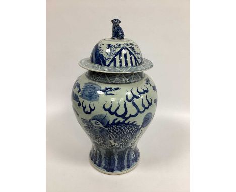 A Chinese Blue and White Porcelain Baluster Vase and Cover, decorated with mythical beasts and stylised flames, crosshatch bo