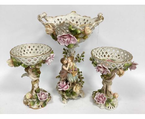 A Garniture of German Late XIX Century Porcelain Centrepiece Bowls, each decorated and encrusted with flowers and modelled wi