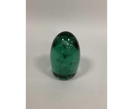 A Large Late XIX Century Green Glass Dump Paperweight, with flowerhead inclusions, 18cm high.