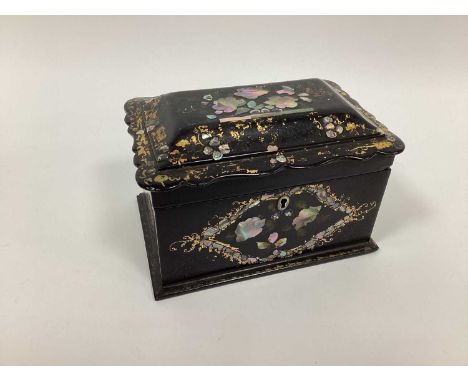 A Mid XIX Century Papier Maché Tea Caddy and Hinged Cover, with shaped rim, inset with mother of pearl in a floral design, th