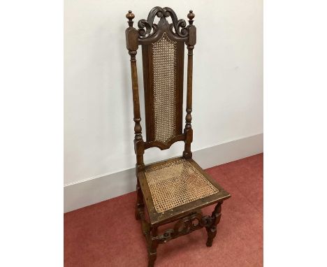 A XVII Century High Back Chair, with a scroll and pierced top rail, caned back and seat, on turned and block supports.