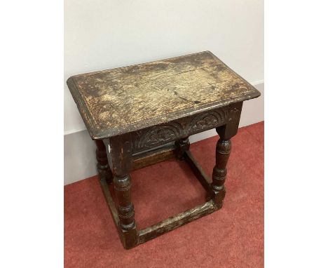 A XVII Century and Later Joined Oak Joint Stool, with carved frieze on turned and block supports united by stretchers.