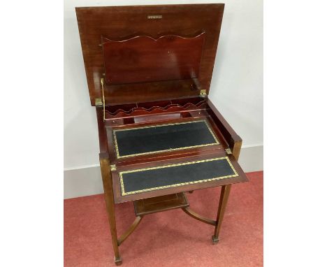 An Edwardian Inlaid Mahogany Writing Desk, with black leather inset hinged top to fitted interior, on tapering supports and s