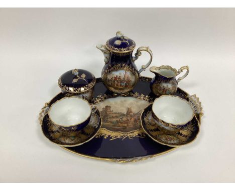 A German Early XX Century Porcelain Cabaret Set, the dark blue grounds decorated in panels with harbour and other scenes, all