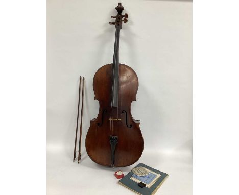 An Early XX Century Cello, no label, two-piece back, two bows and a folder of sheet music, strings, etc.  the length of the n