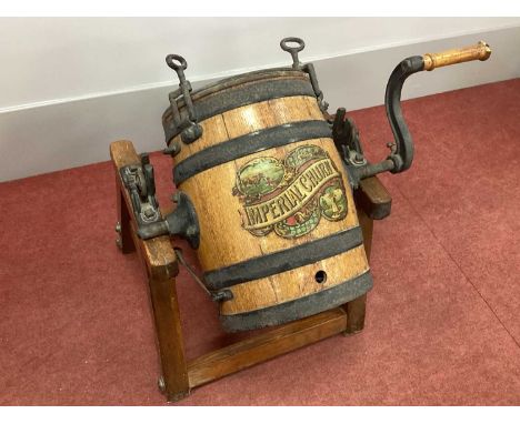 An Early XX Century Oak Iron Bound Butter Churn on Stand, labelled "The Imperial Butter Churn" and metal plate "The Separator