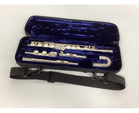 A Trevor J. James Flute, model TJ10 X111, No 29853, with straight and curved head joints, in carrying case.