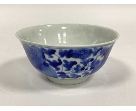 A Chinese Blue and White Porcelain Bowl, painted with flower heads to the exterior, character mark to base, 14cm diameter.No 