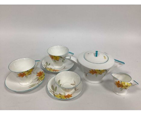 A Shelley Porcelain Afternoon Tea Service, in the Eve shape and decorated with orange and yellow flowers, printed marks, comp