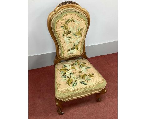 A XIX Century Walnut Chair, with carved top rail, floral woolwork back and seat, on cabriole legs.