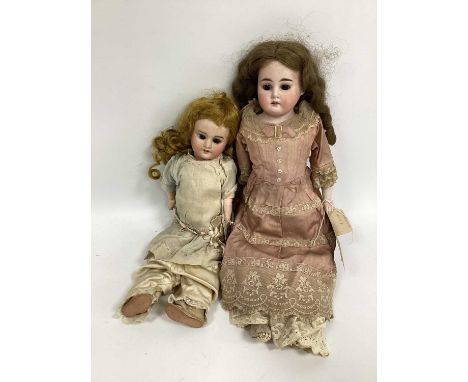 A SFBJ Victorian Bisque Headed Doll, with painted features, open mouth and closing eyes, jointed body, 35cm; An Armand Marsei