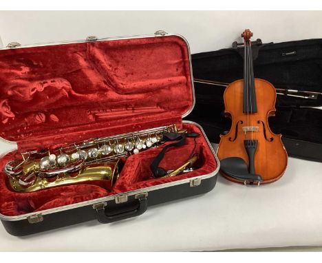 A Modern 'Armstrong' Saxophone, in case and a modern violin and bow (no label) in case. (2)