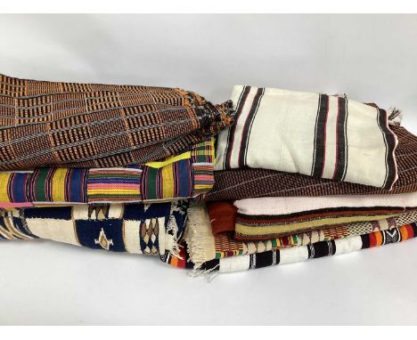 An Ashanti Kente Cloth, Ghana cotton, with a colourful geometric design, and six other African throws/blankets. (7)Kente clot