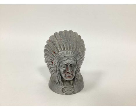 A Guy Motors Red Indian Head Aluminium Car Radiator Mascot, engraved 'Feathers in Our Cap', 12cm high.