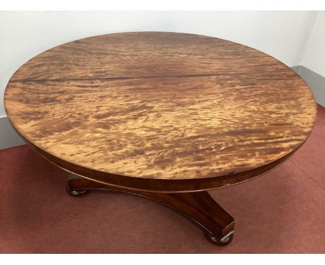 A XIX Century Mahogany Breakfast Table, with circular top on triform pedestal and base, on bun feet, 136cm wide.