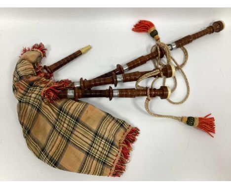 A Set of Mid XX Century Bagpipes, with tartan chanter and turned wood with white metal ferrules, bone mouth-pieces.