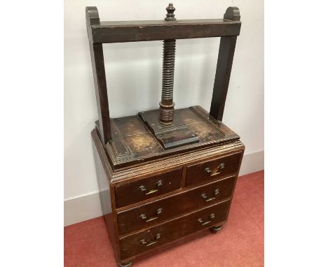 A XIX Century Oak Book Press, with spiral thread and turned arm, two short and two long drawers, on turned feet, 150cm high, 