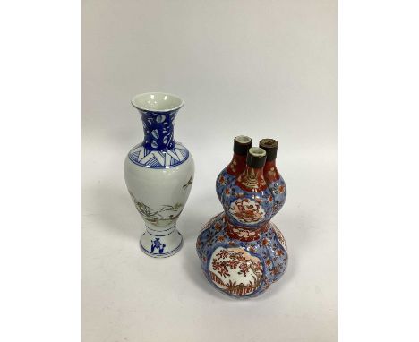 A Chinese Porcelain Vase, of baluster form, decorated with geese within blue and white borders, character mark to base, 20cm 