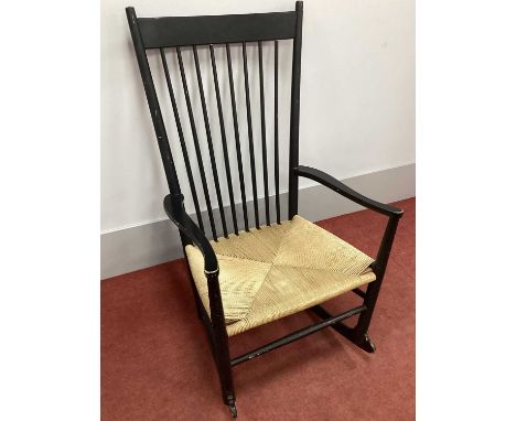 Hans J. Wenger; A Mid XX Century Ebonised Rocking Chair, model J16, with original cord seat.polish loss to the top of chair s