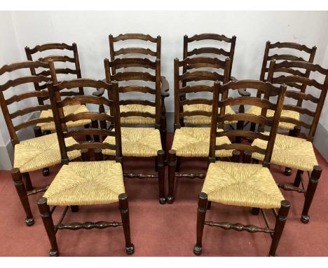 A Set of Ten XIX Century Style Ash Ladder Back Chairs (Two Carver, Eight Single), with rushed seats on turned legs and pad fe