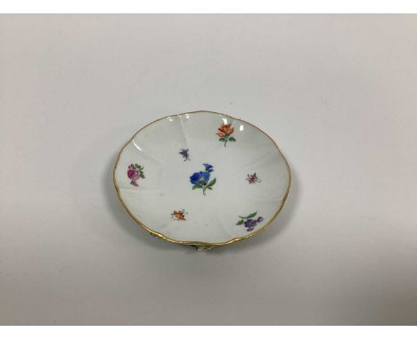 A Meissen Porcelain Dish, of shaped circular form, decorated with floral sprays, the underside encrusted with flowers, blue c