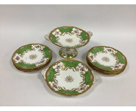 A Coalport Porcelain Dessert Service, decorated in the green bat wing pattern with sprays of flowers between gilt borders, pr