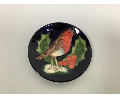 A Moorcroft Pottery Circular Pin Tray, painted with a robin on a holly sprig, designed by Sally Tuffin, impressed and painted