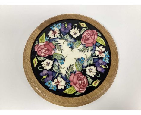 A Moorcroft Pottery Circular Plaque, painted in the 'Victorian Valentine' design by Nicola Slaney, limited edition No 6/25, s