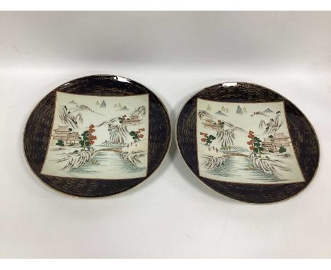 A Pair of Late XIX Century Artita Japanese Pottery Chargers, of circular form decorated with pagodas in river landscapes, wit