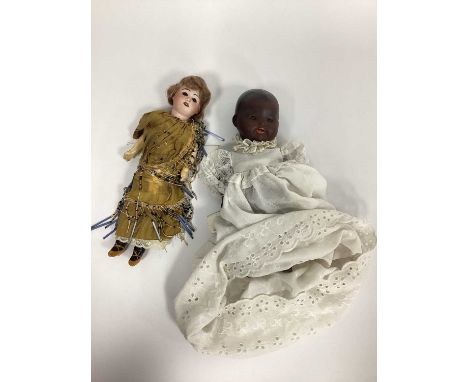 An Armand Marseilles Bisque Headed Black Baby Doll, with painted features, open mouth and closing eyes, 27cm long; A SFBJ Dol