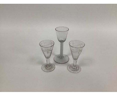 A XIX Century Wine Glass, the ogee bowl raised on white enamel twist stem and domed circular foot, 15cm high and a pair of sh